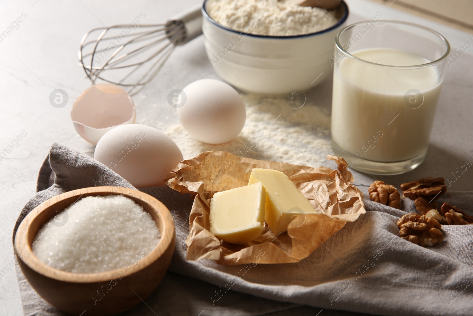 Photo of Different ingredients for dough on table, closeup