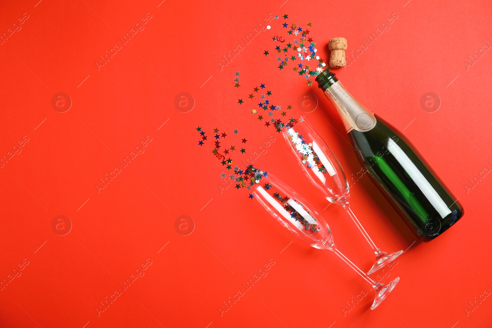 Photo of Creative flat lay composition with bottle of champagne and space for text on color background