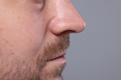 Closeup view of man with normal skin on grey background, space for text