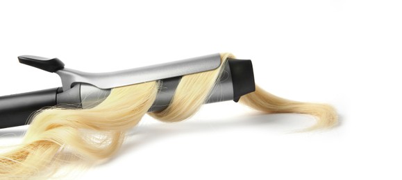 Photo of Curling iron with blonde hair lock on white background