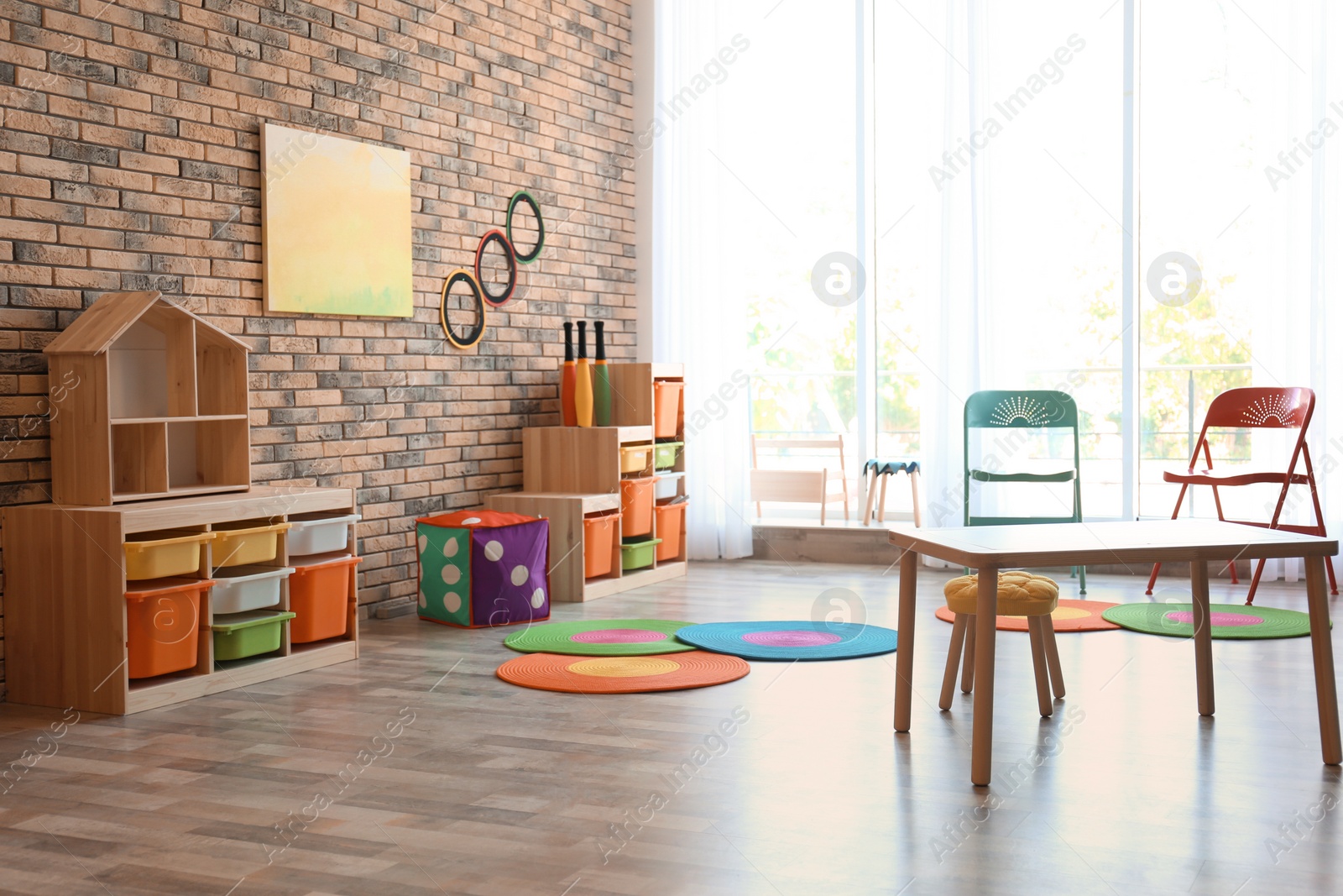Photo of Stylish child room interior with colorful furniture
