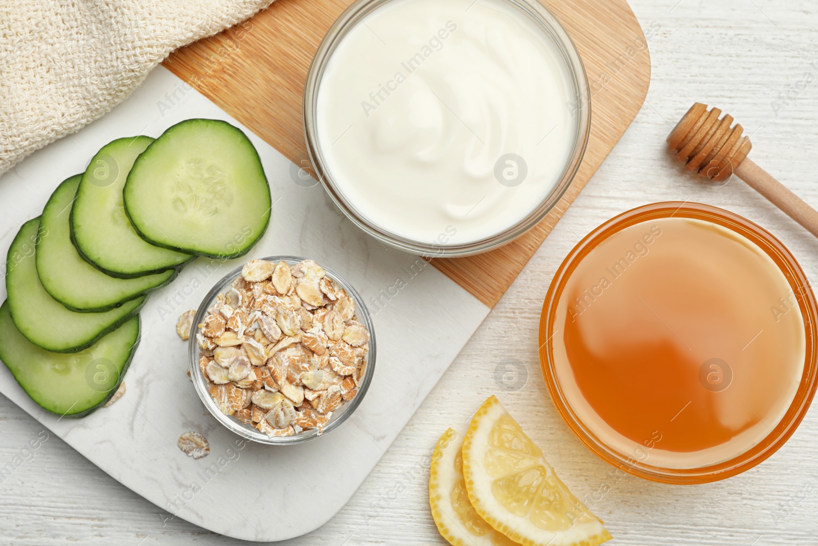 Photo of Different ingredients for handmade face mask on table, flat lay