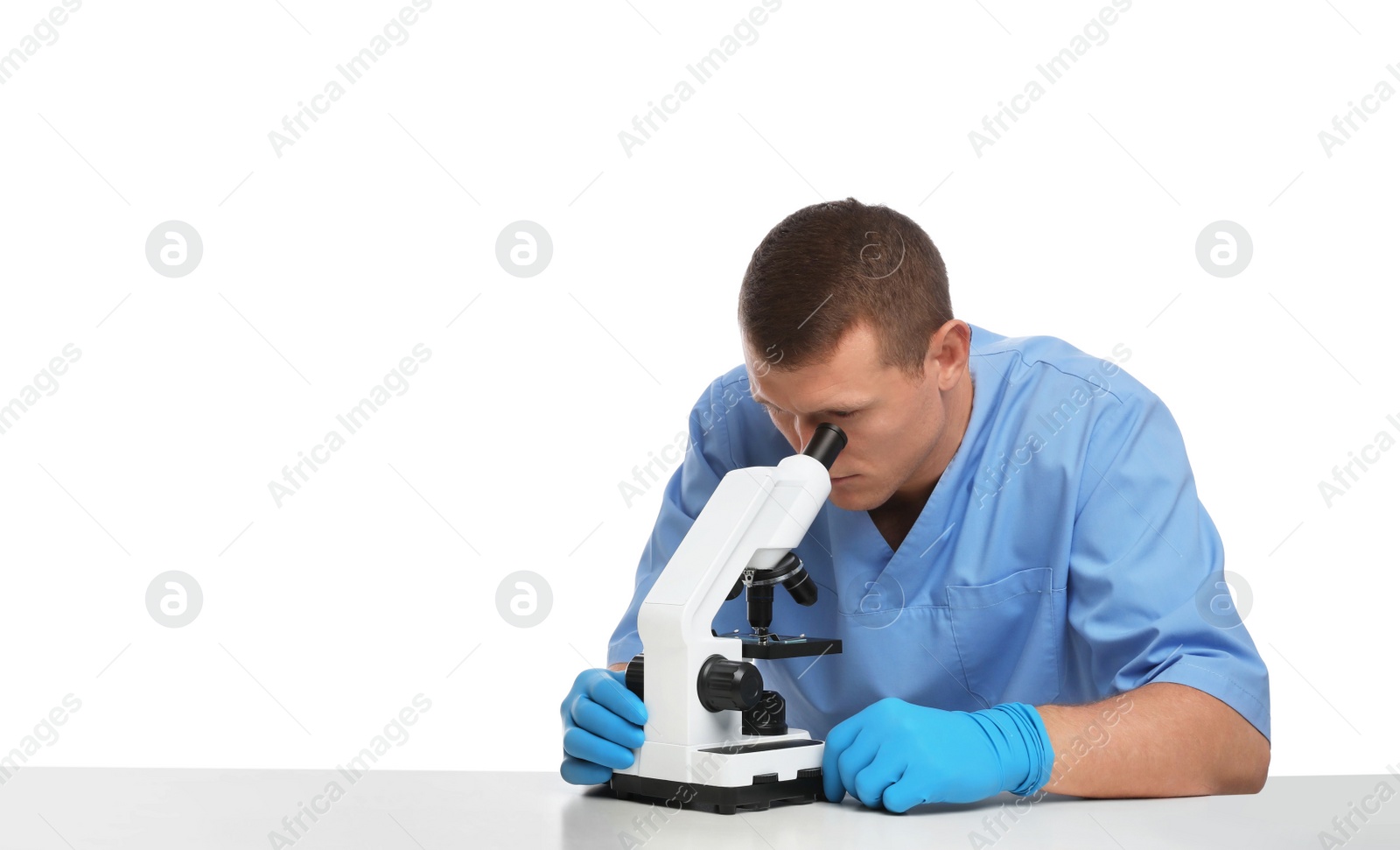 Photo of Scientist using modern microscope at table isolated on white. Medical research