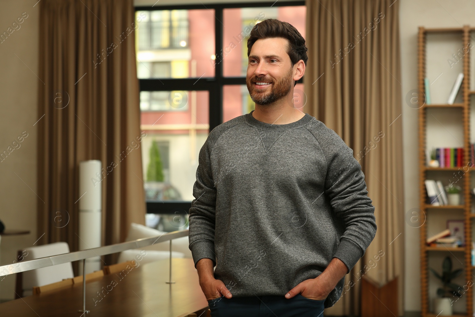 Photo of Portrait of handsome stylish man in office