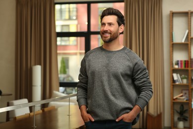 Portrait of handsome stylish man in office