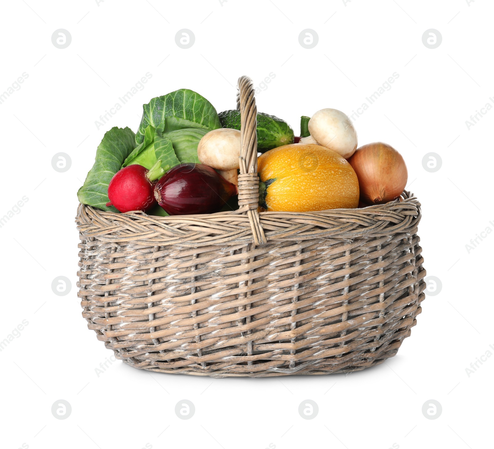 Photo of Wicker basket of fresh vegetables isolated on white