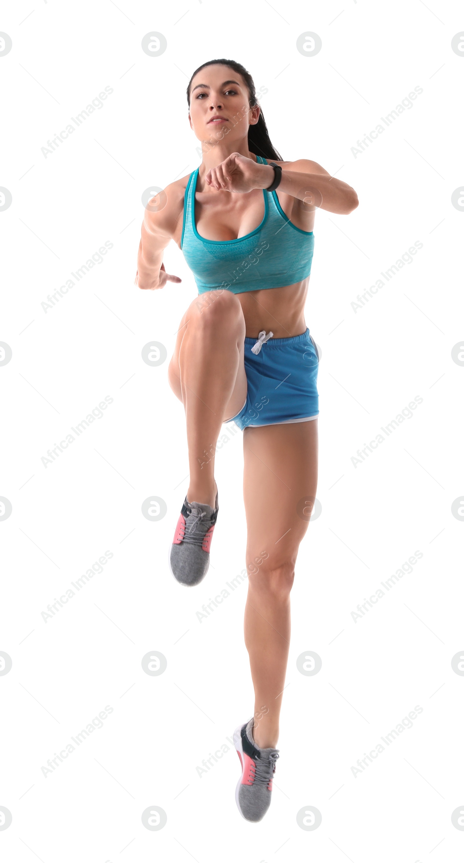 Photo of Athletic young woman running on white background