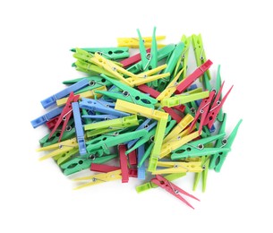 Colorful plastic clothespins on white background, top view