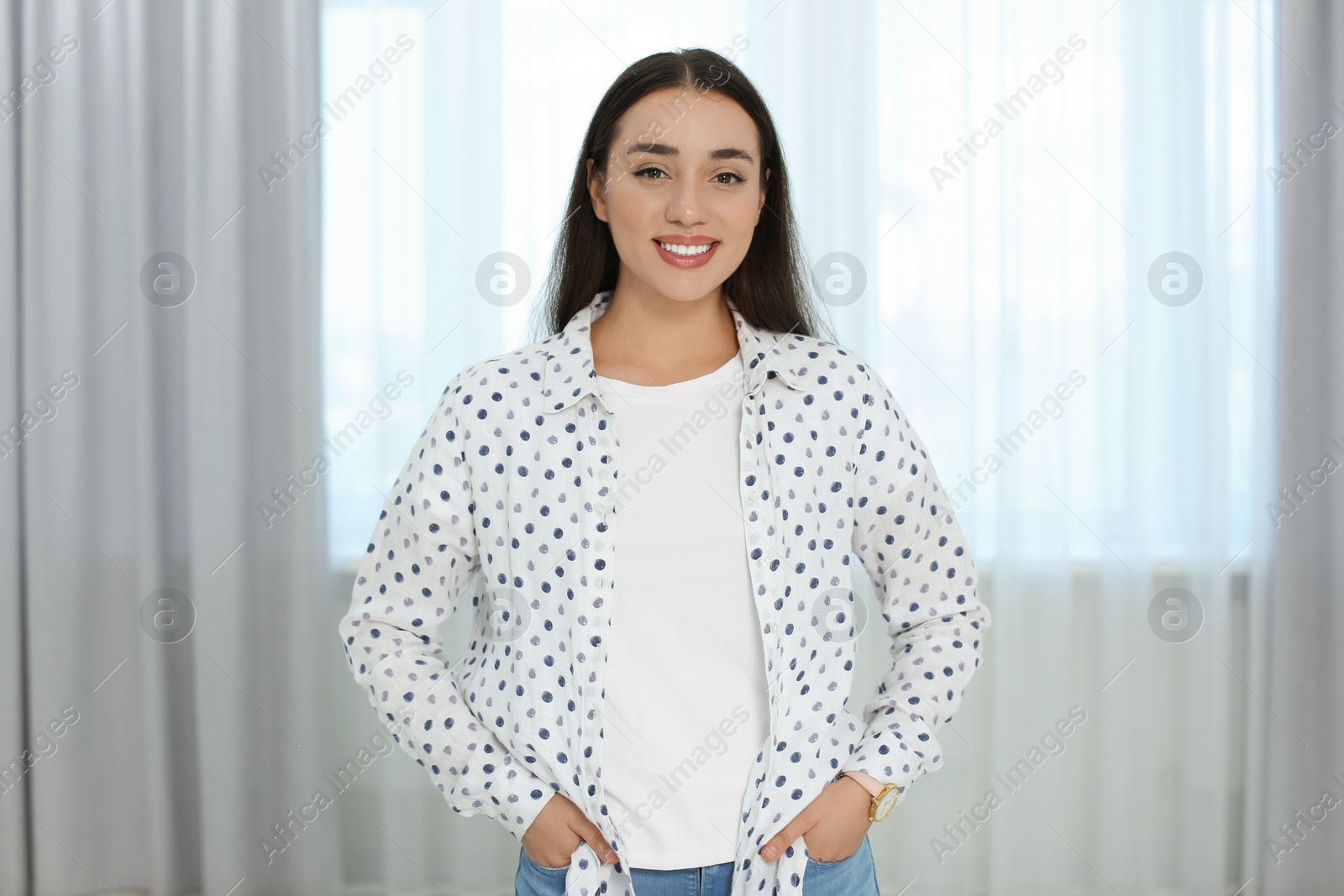 Photo of Portrait of beautiful young woman at home