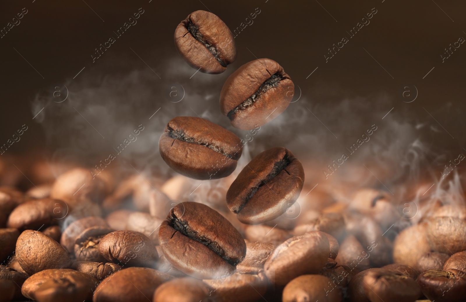 Image of Aromatic roasted coffee beans and steam, closeup