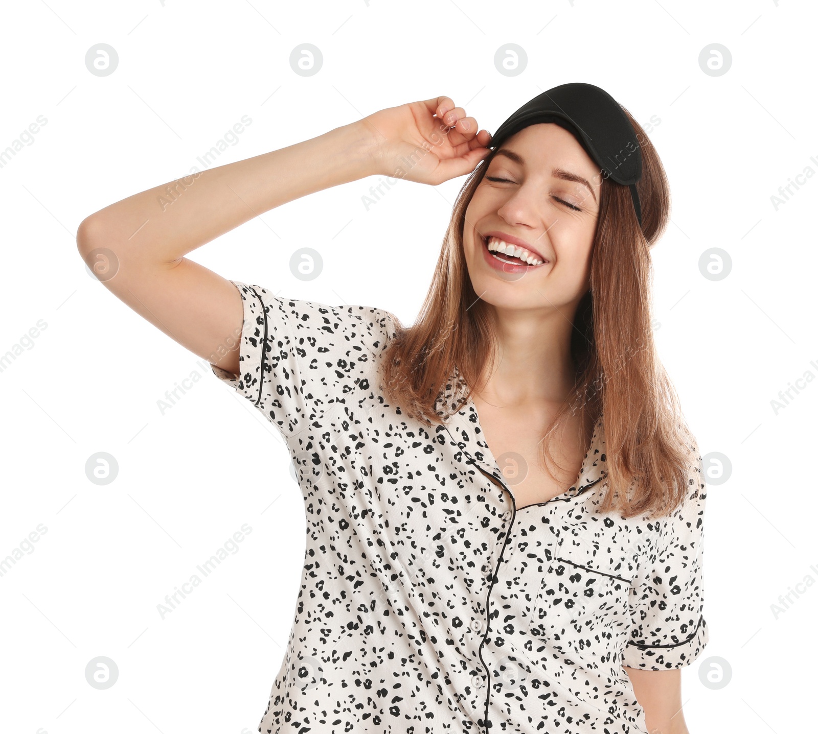 Photo of Beautiful woman wearing pajamas and sleep mask on white background. Bedtime