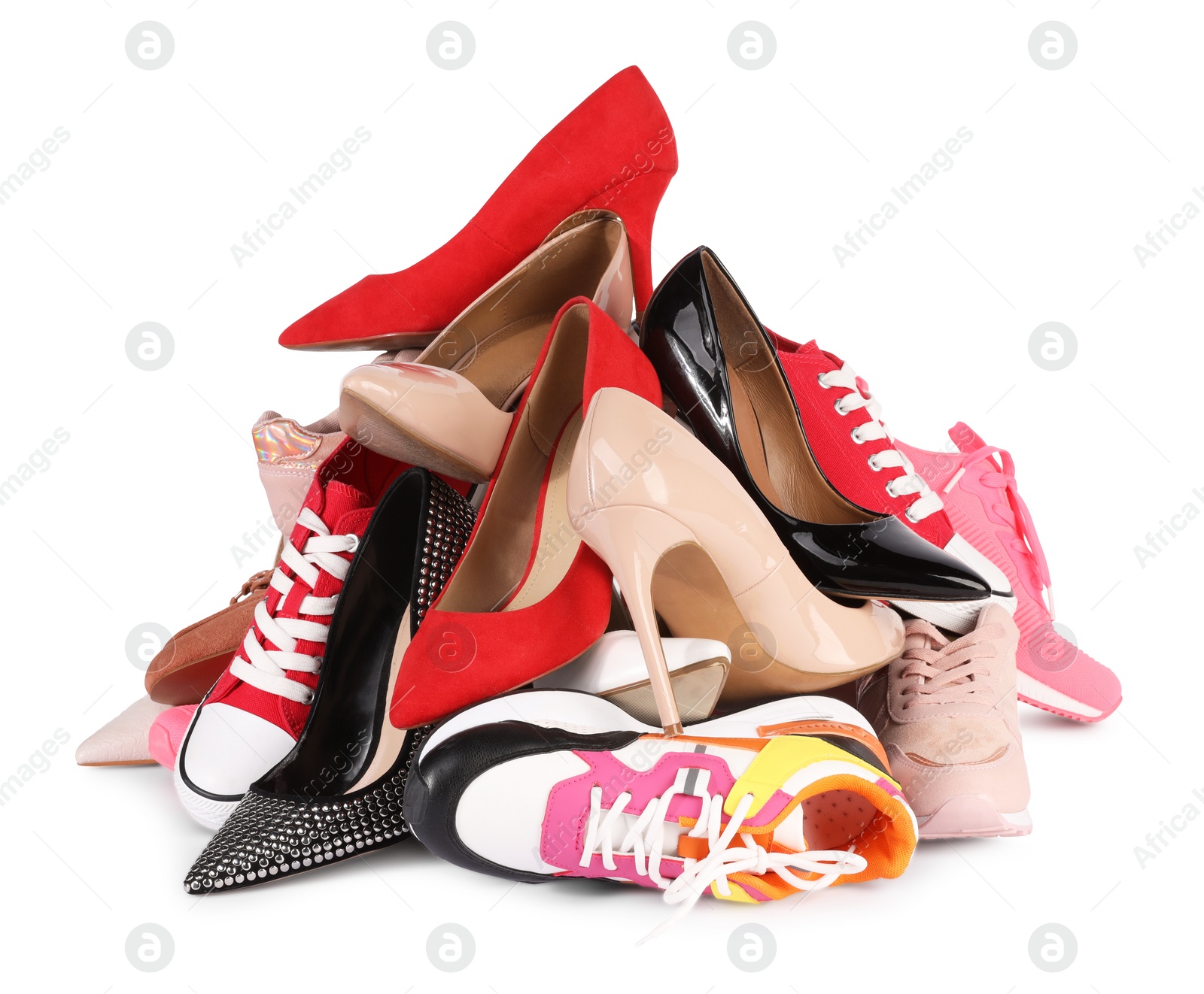 Photo of Pile of different female shoes isolated on white