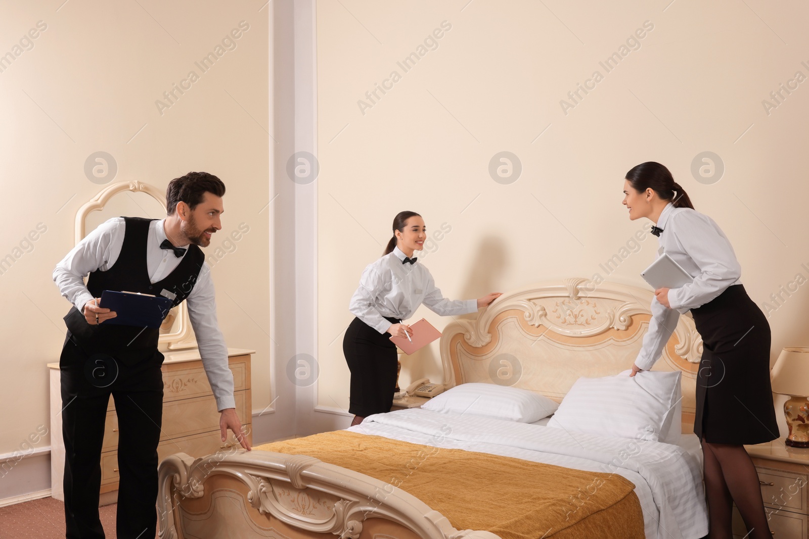 Photo of Group of people attending professional butler courses in hotel