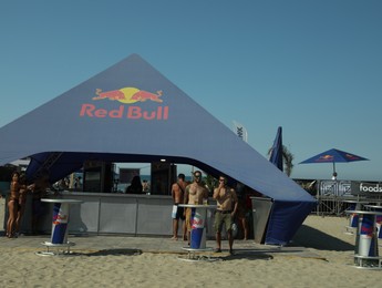 SENIGALLIA, ITALY - JULY 22, 2022: Red Bull tent on beach under blue sky