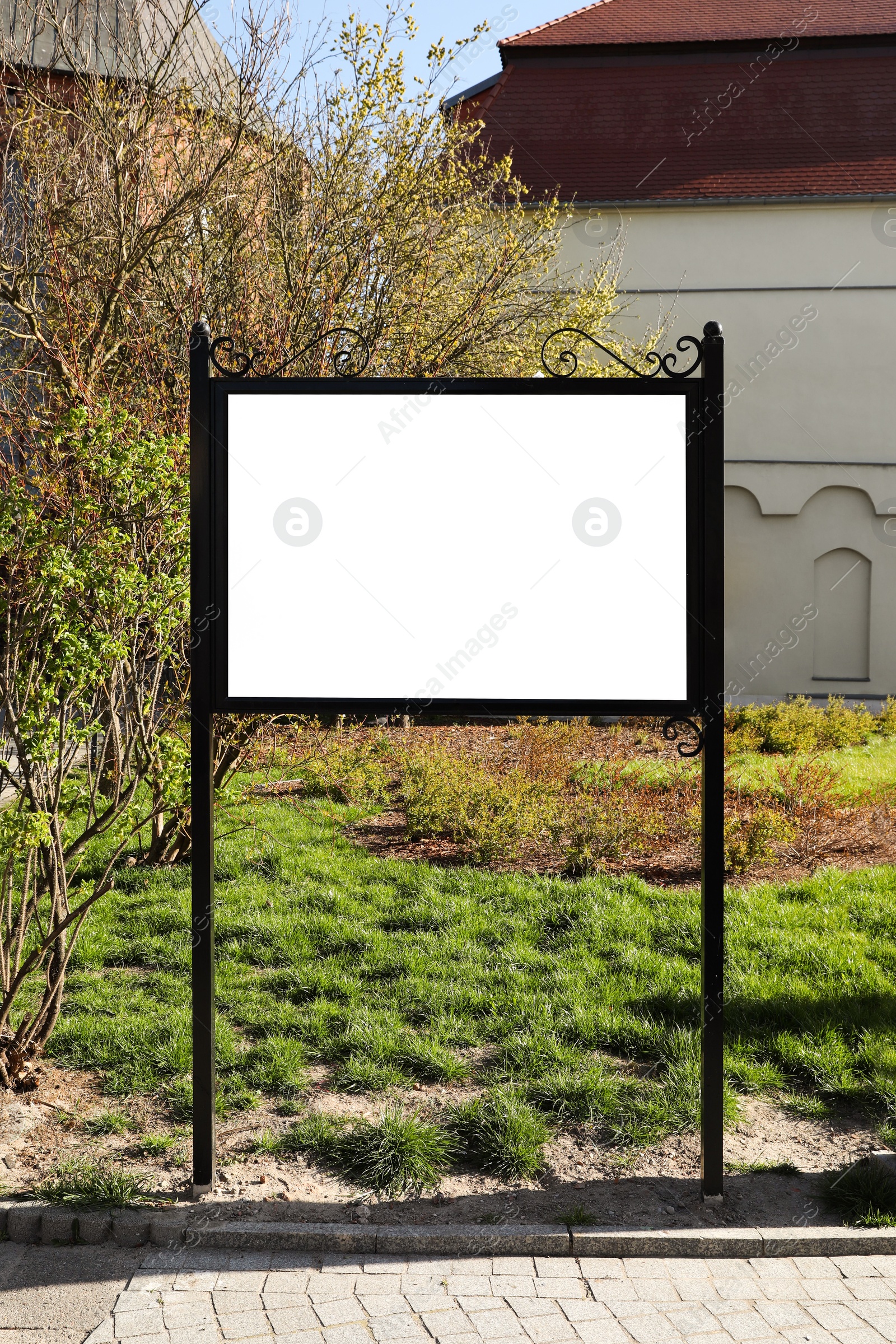 Image of Empty signboard outdoors on sunny day. Mock-up for design