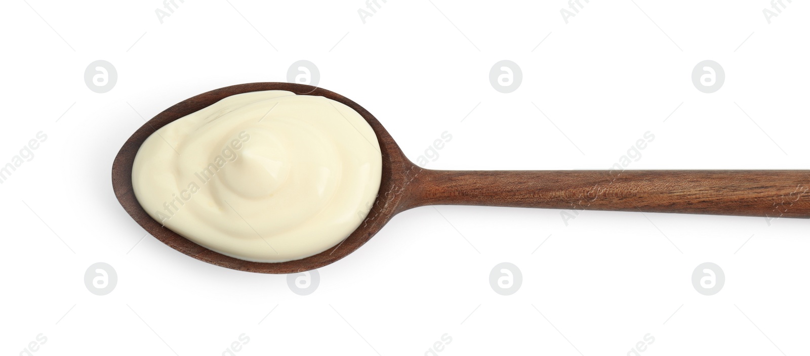 Photo of Fresh mayonnaise sauce in wooden spoon isolated on white, top view