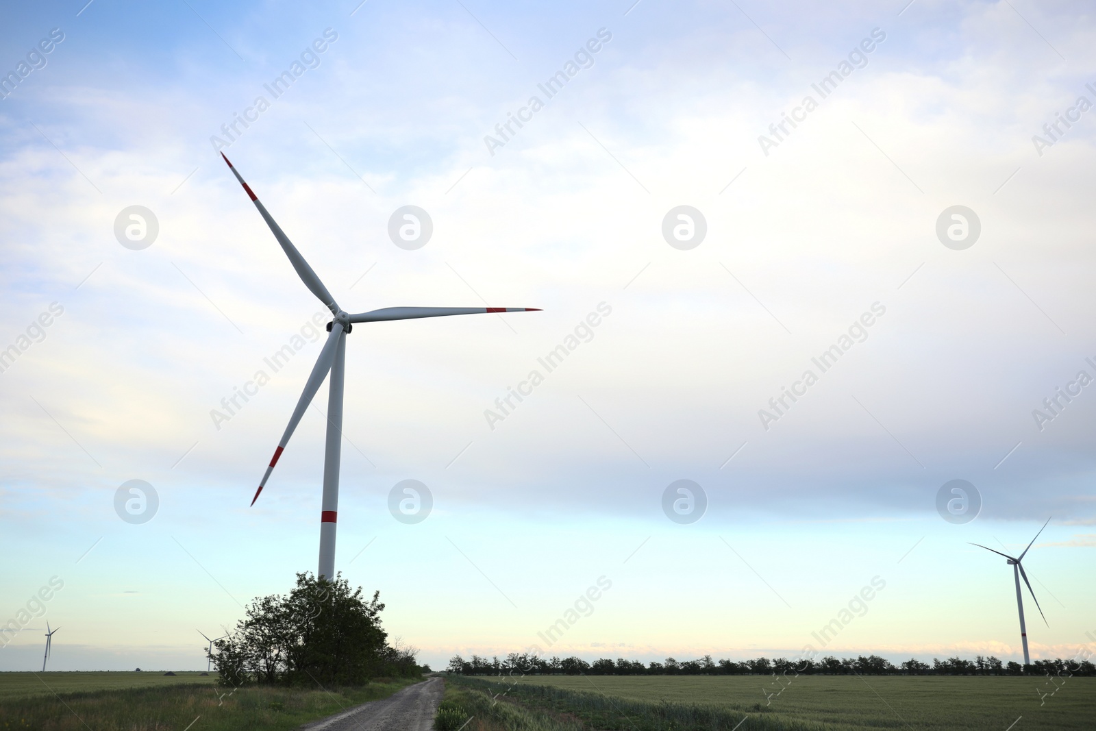 Photo of Beautiful view of landscape with wind turbine. Alternative energy source