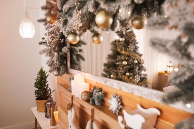 Photo of Wooden decorated mantelpiece at home. Christmas interior