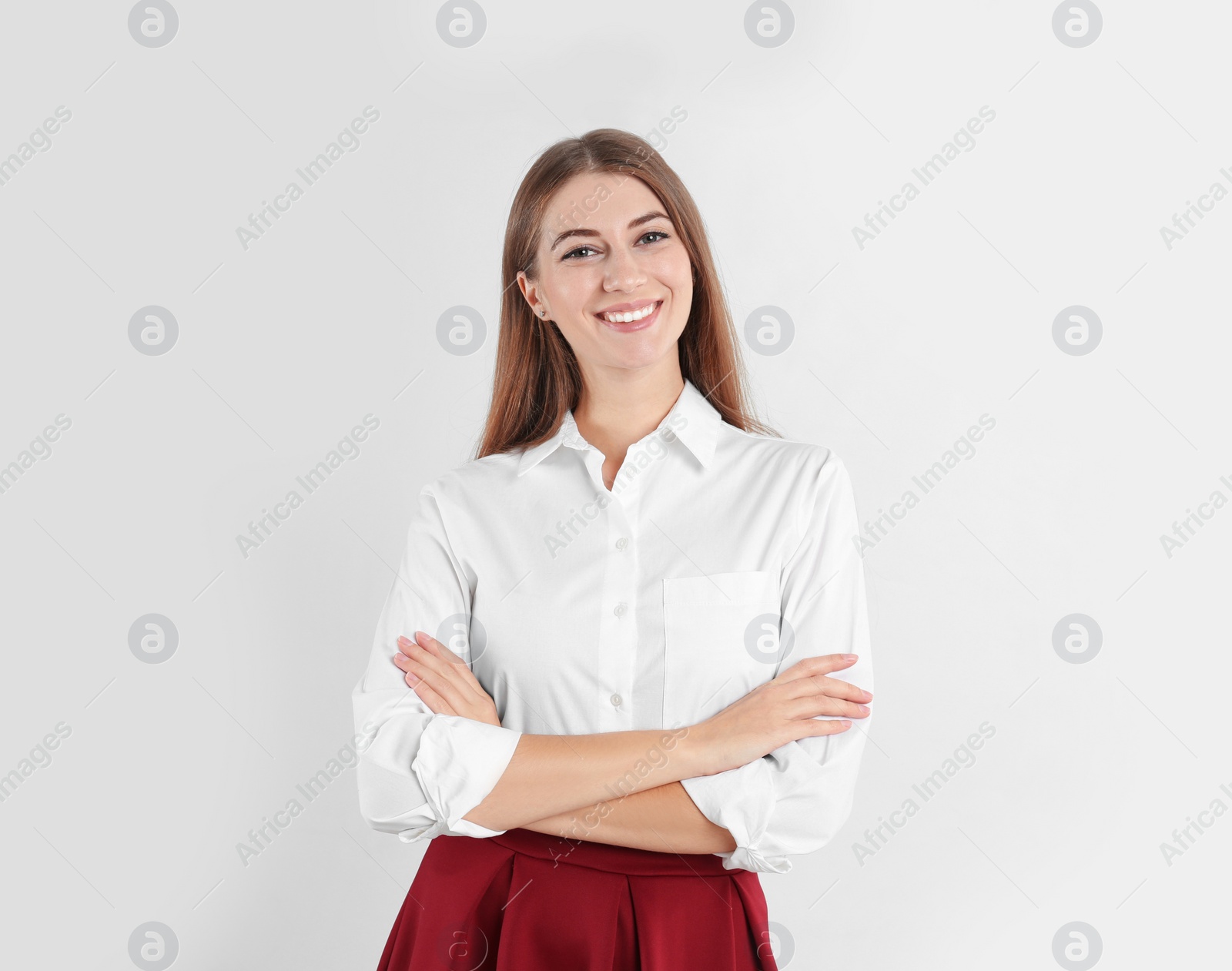 Photo of Portrait of beautiful young businesswoman on white background