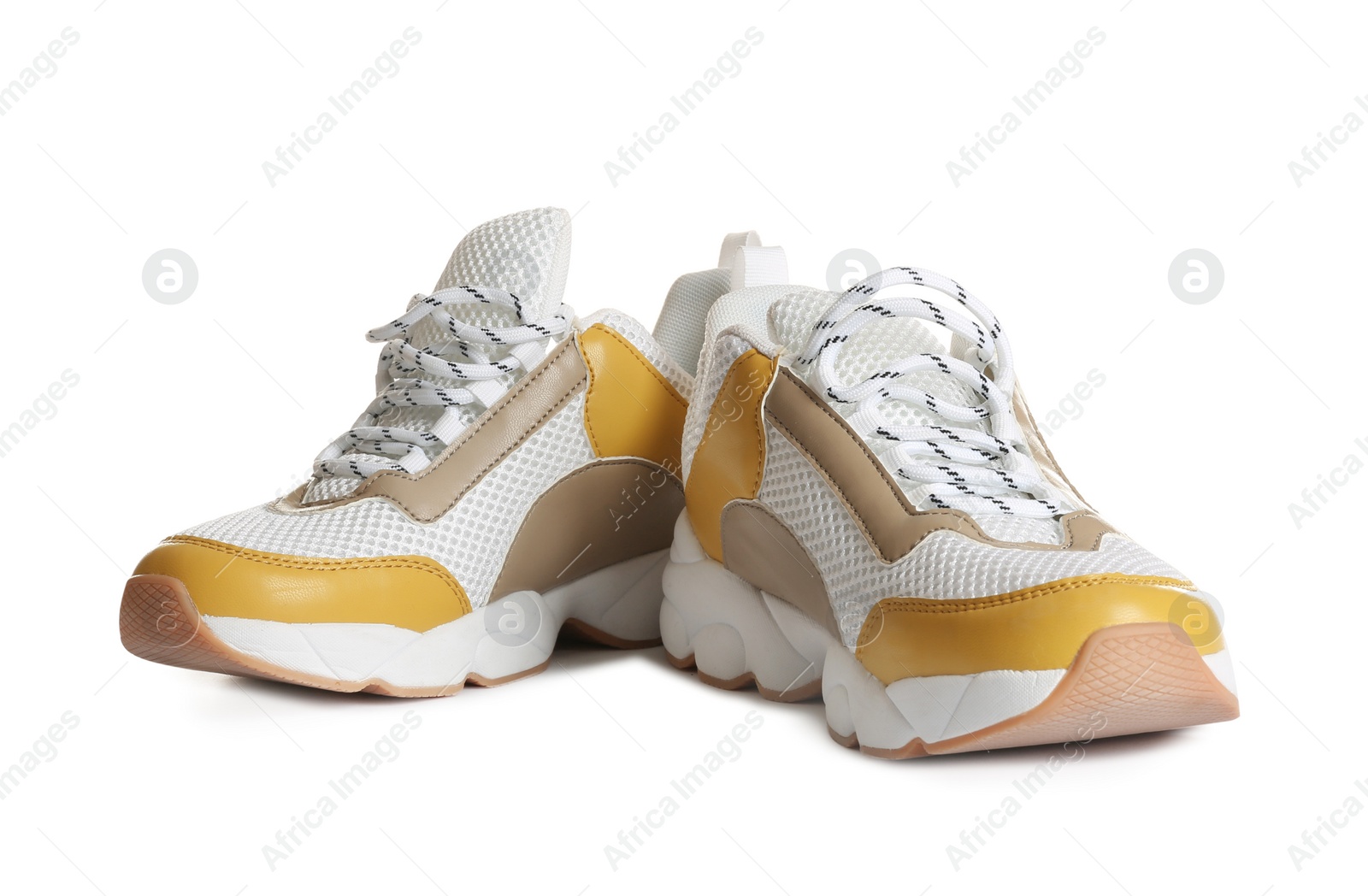 Photo of Pair of sports shoes on white background