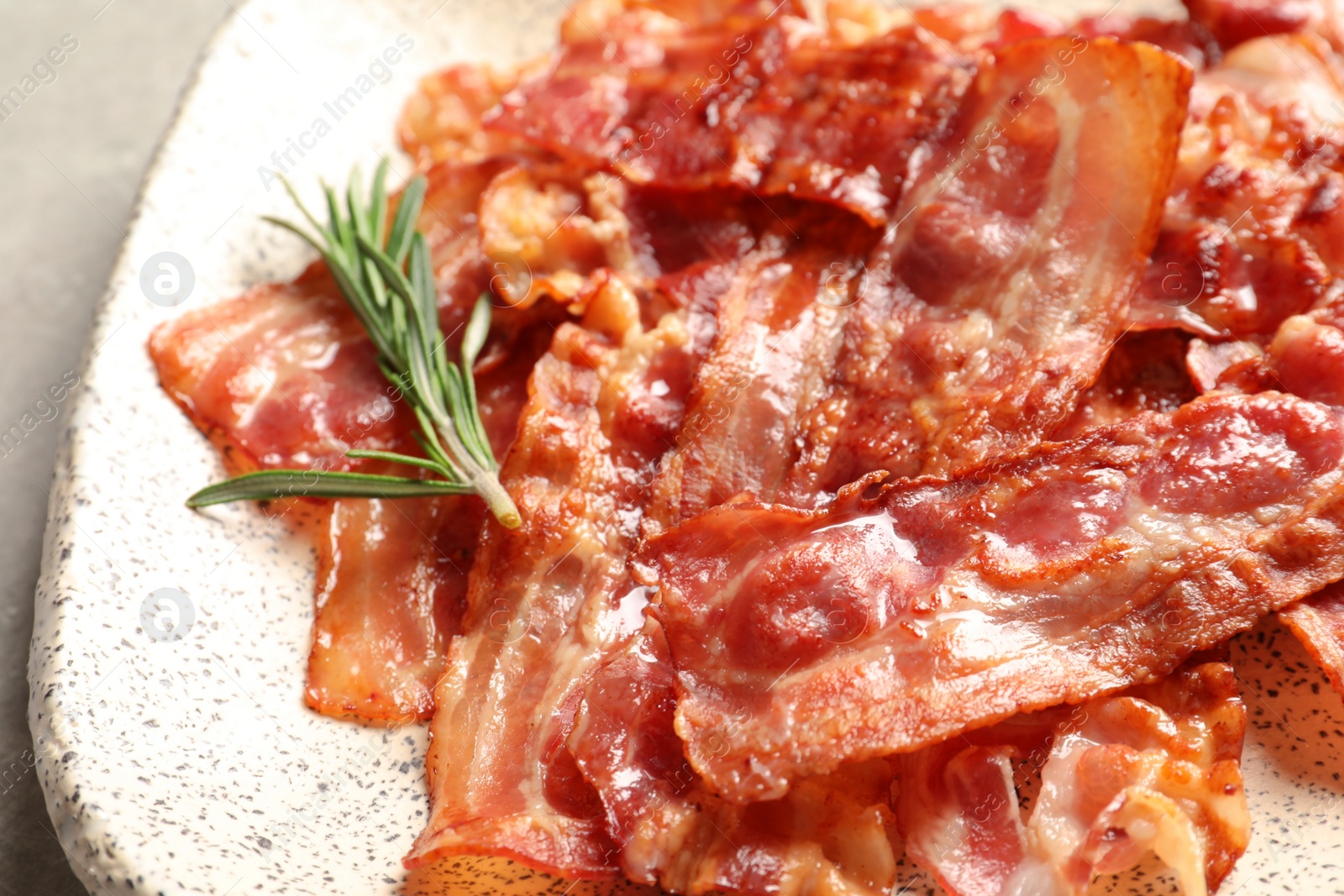 Photo of Plate with fried bacon, closeup