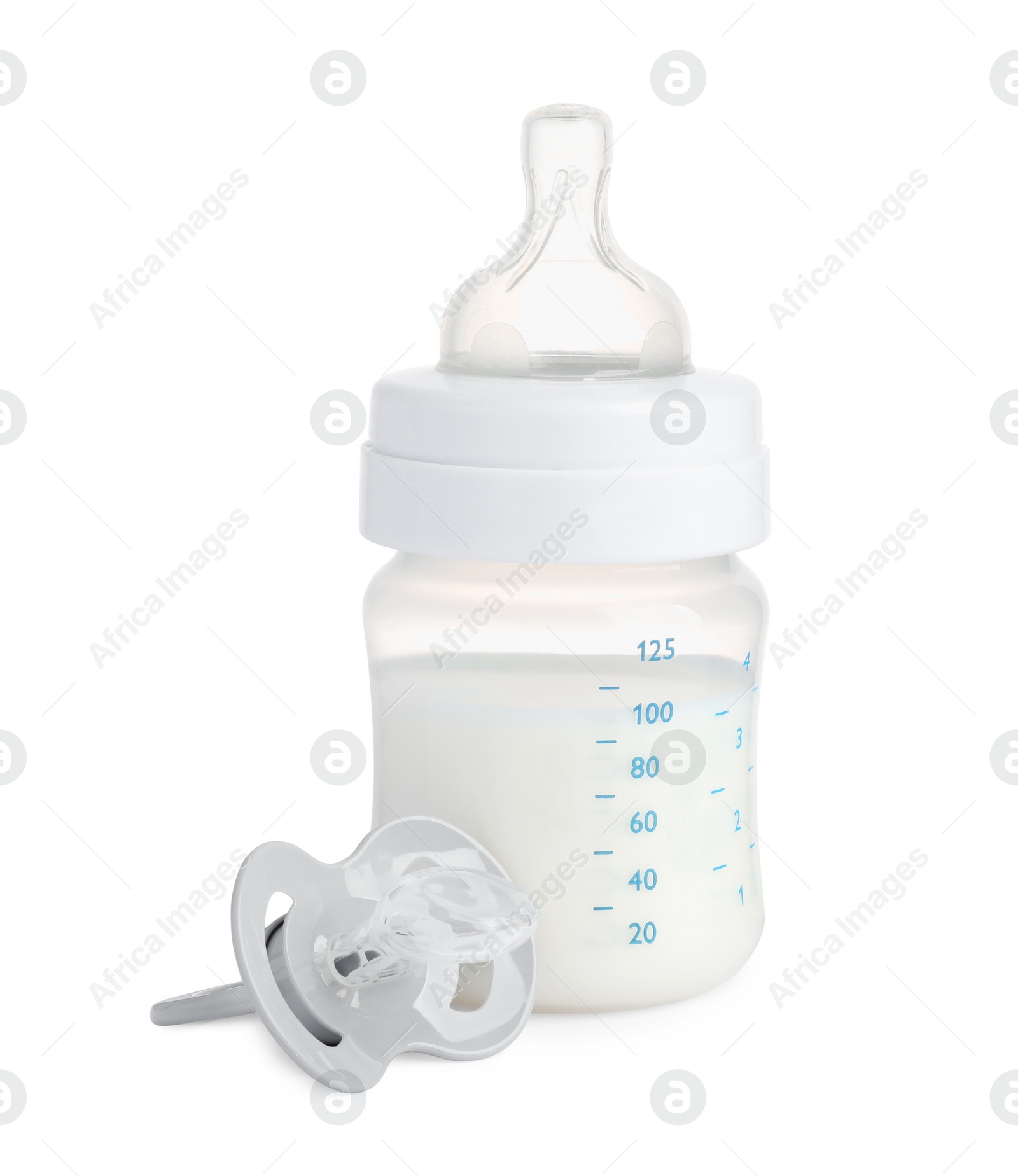 Photo of Bottle with milk and baby pacifier on white background