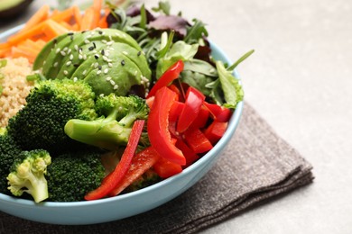 Photo of Delicious vegan bowl with bell peppers, avocados and broccoli on table, closeup. Space for text