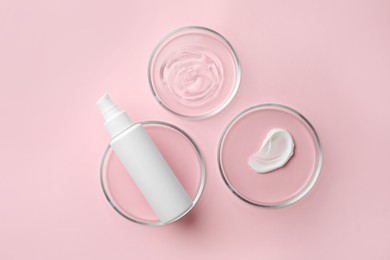 Petri dishes and cosmetic products on pink background, flat lay