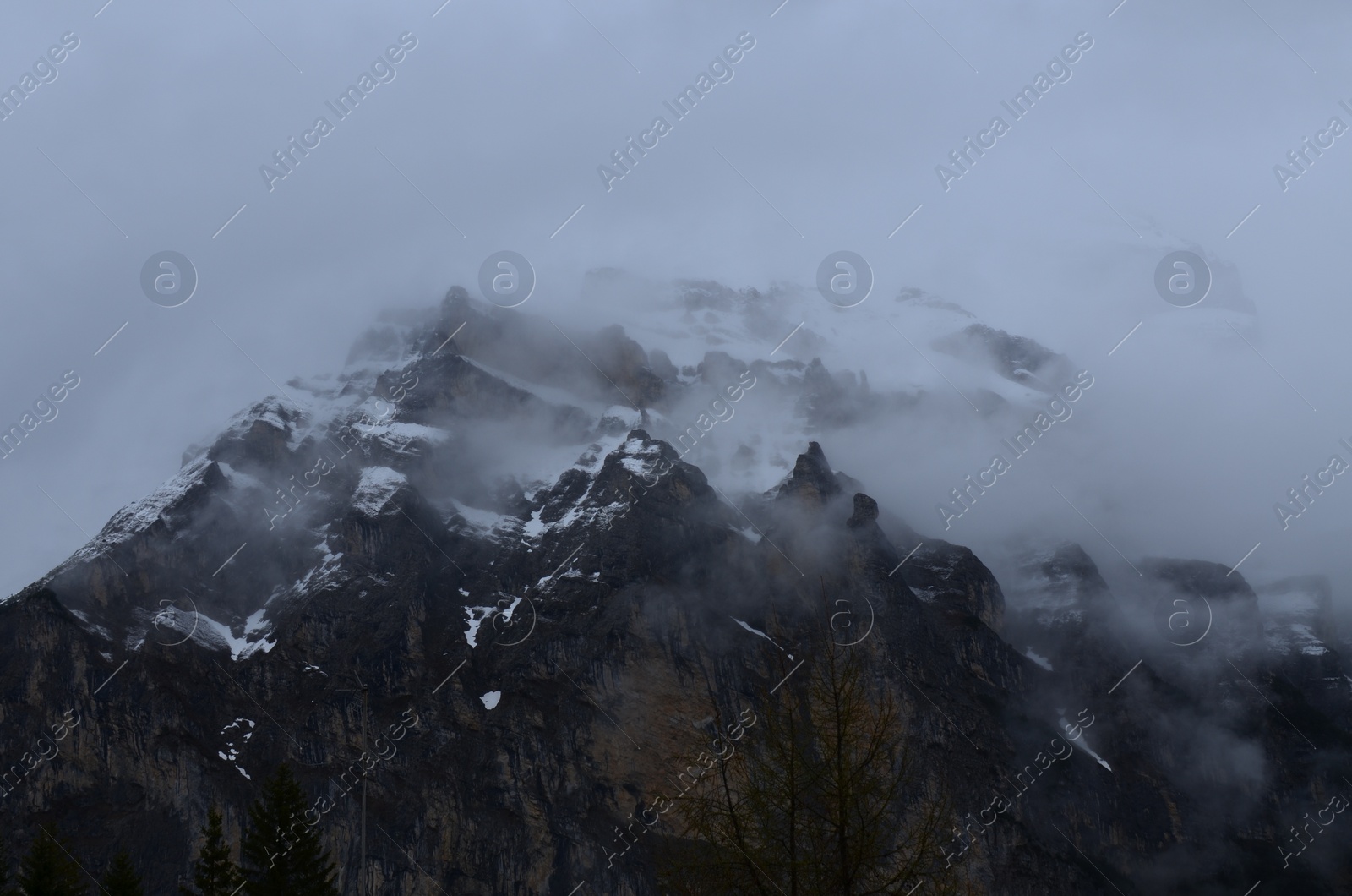 Photo of Picturesque view of mountain covered with fog