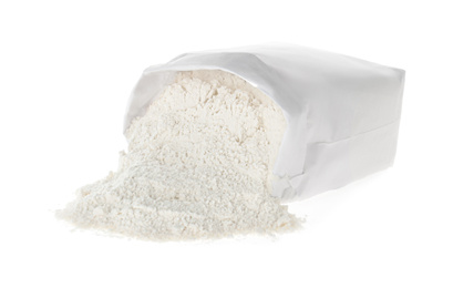 Photo of Overturned paper bag with flour isolated on white