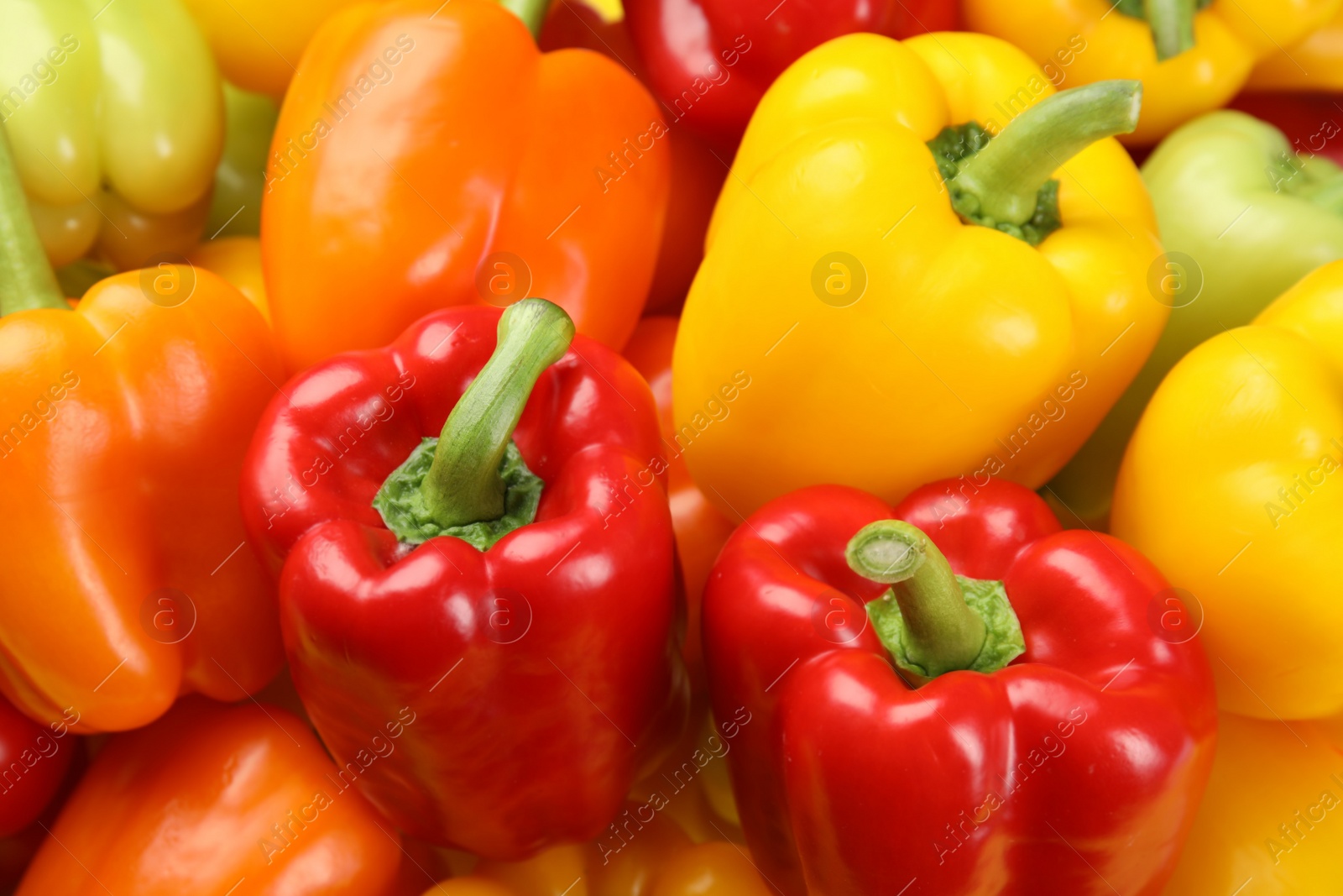 Photo of Fresh ripe colorful bell peppers as background, closeup