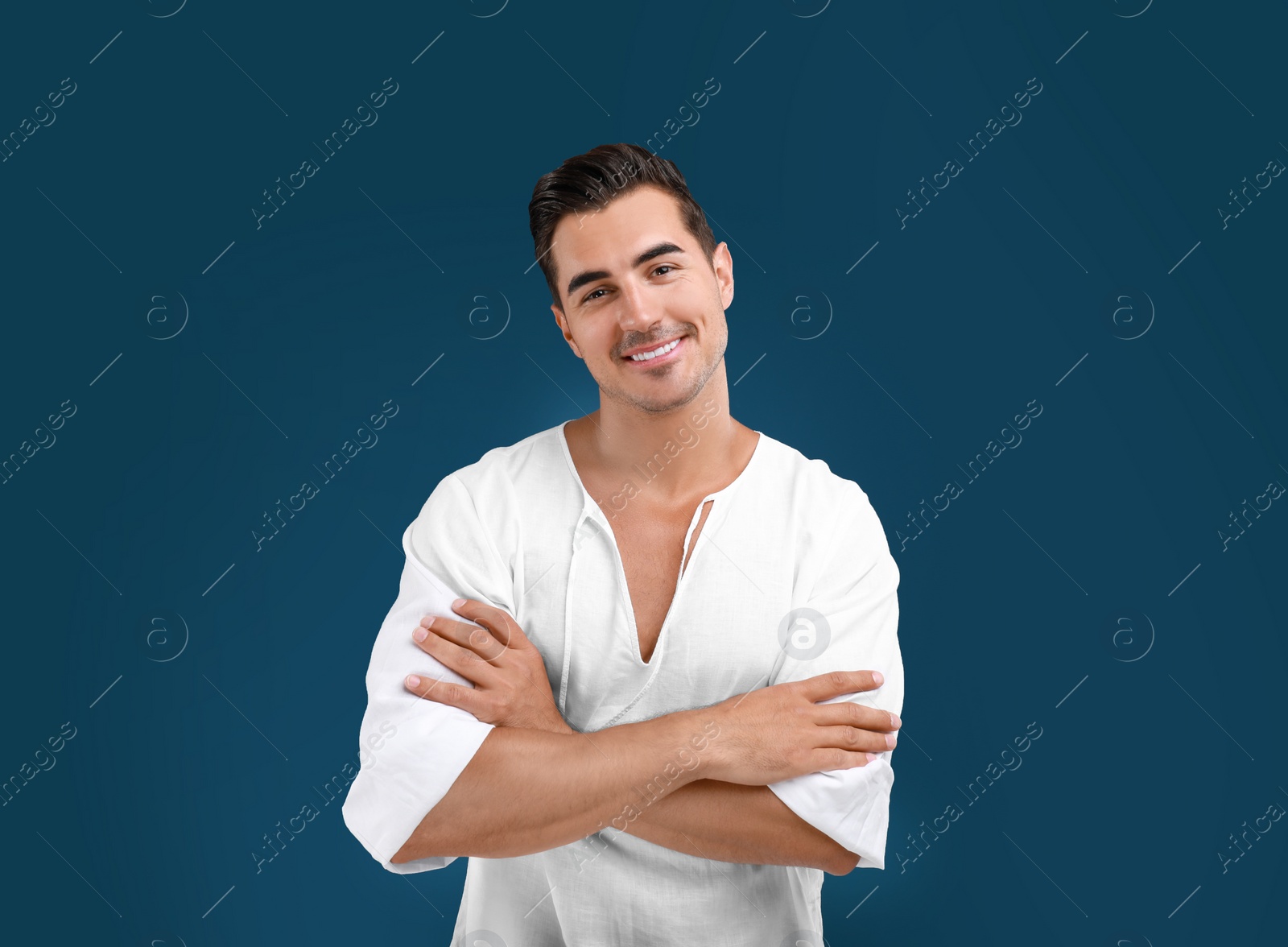 Photo of Portrait of handsome young man on blue background