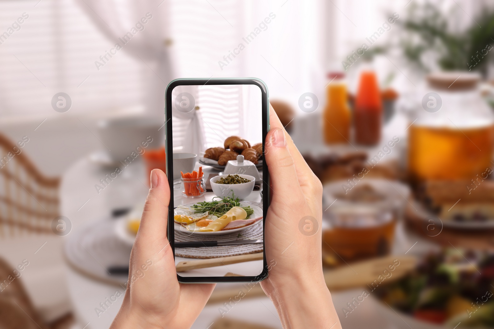 Image of Woman taking picture of different dishes served on wooden table, closeup