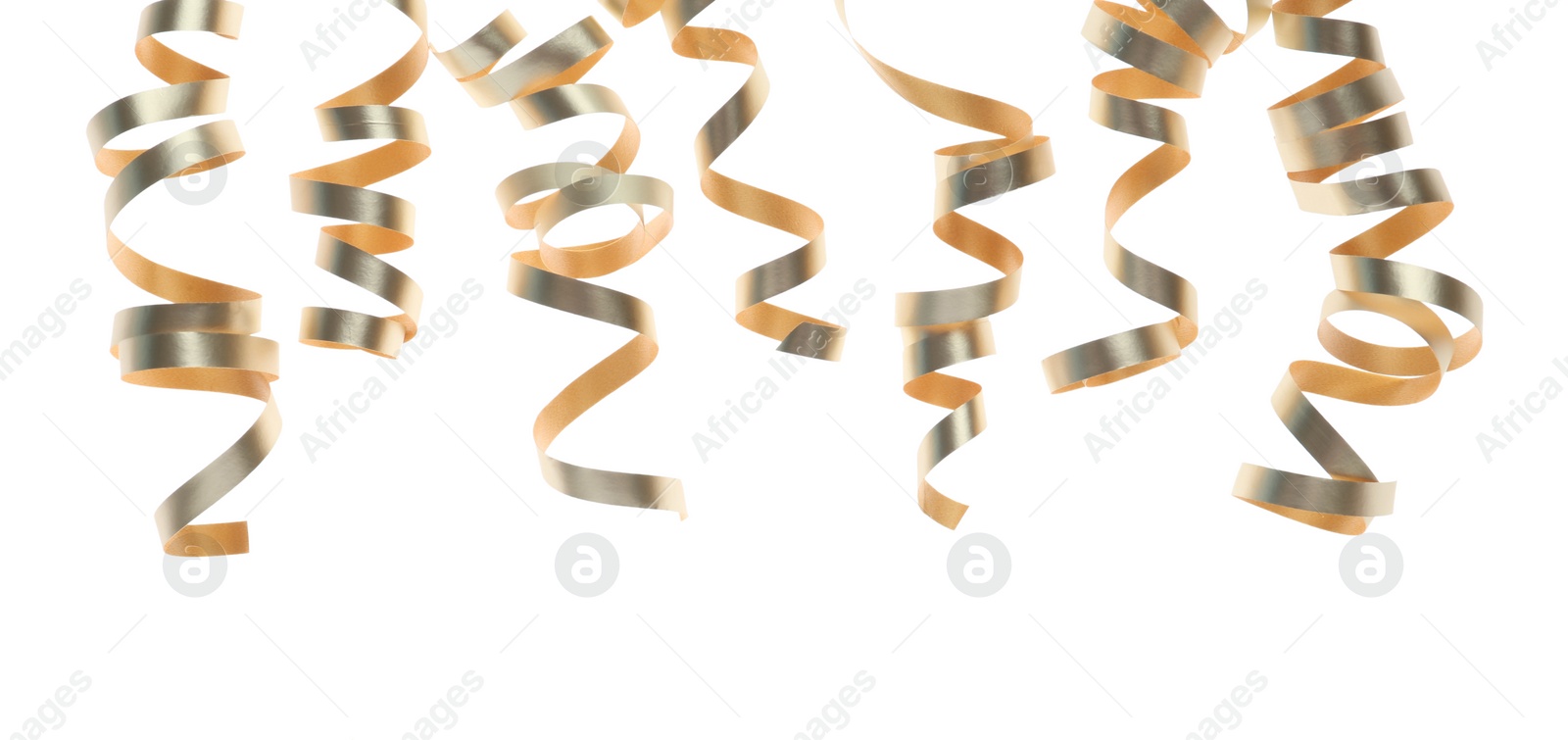 Photo of Shiny serpentine streamers on white background. Festive decor