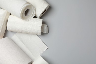 Photo of Many rolls of paper towels on grey background, flat lay. Space for text