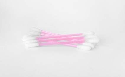 Photo of Clean cotton buds isolated on white. Hygienic product