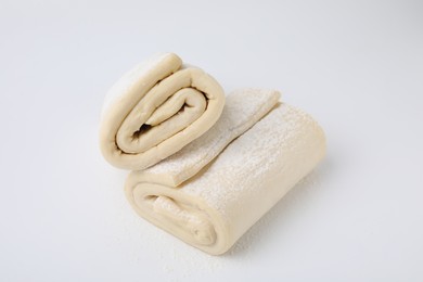 Raw puff pastry dough isolated on white