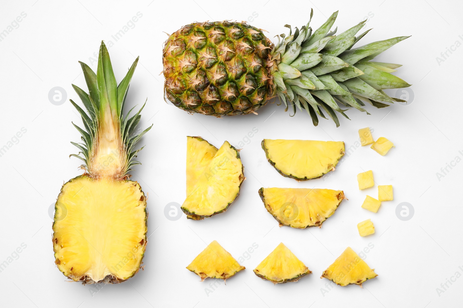 Photo of Flat lay composition with cut and fresh juicy pineapples on white background