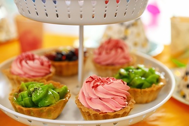 Photo of Delicious cupcakes prepared for birthday party on table