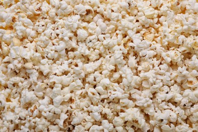 Tasty pop corn as background, top view