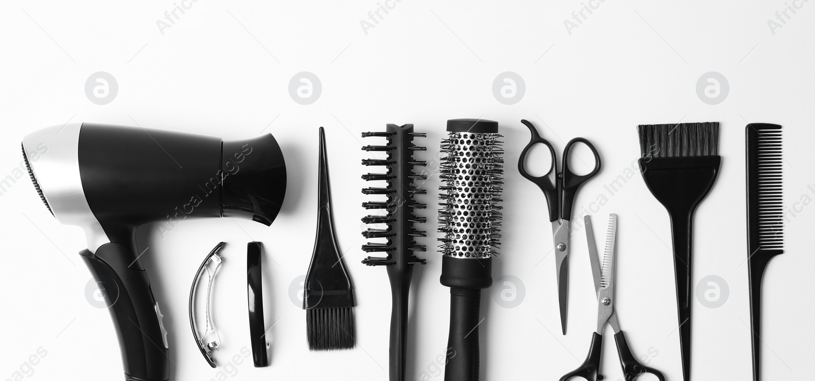 Image of Set of different professional hairdresser tools on white background, flat lay. Banner design