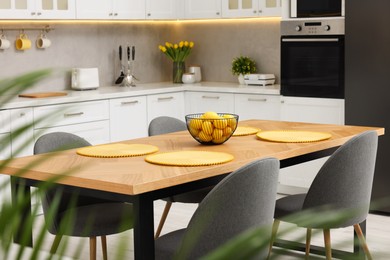 Photo of Spring atmosphere. Stylish kitchen interior with comfortable furniture