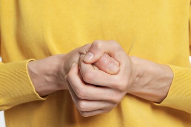 Closeup of woman cracking her knuckles. Bad habit