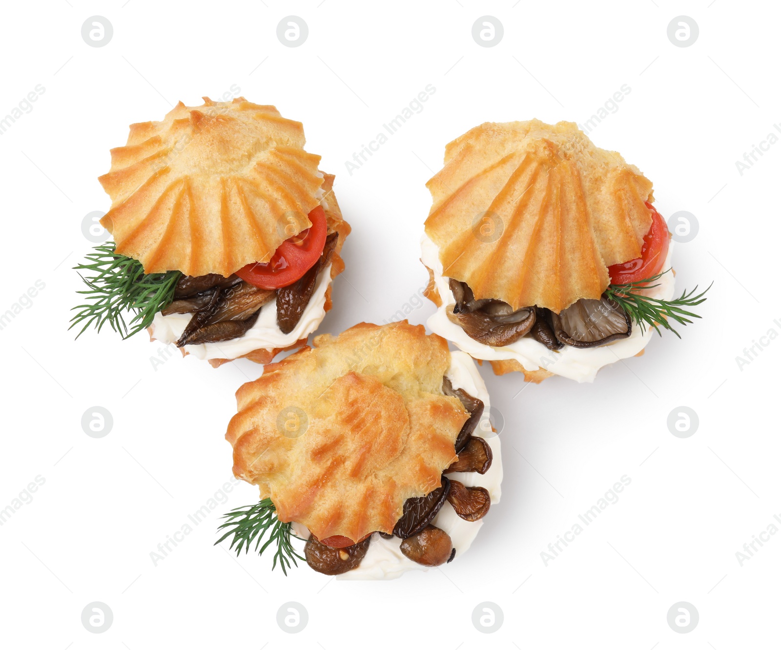 Photo of Delicious profiteroles with cream cheese, mushrooms, tomato and dill on white background, top view