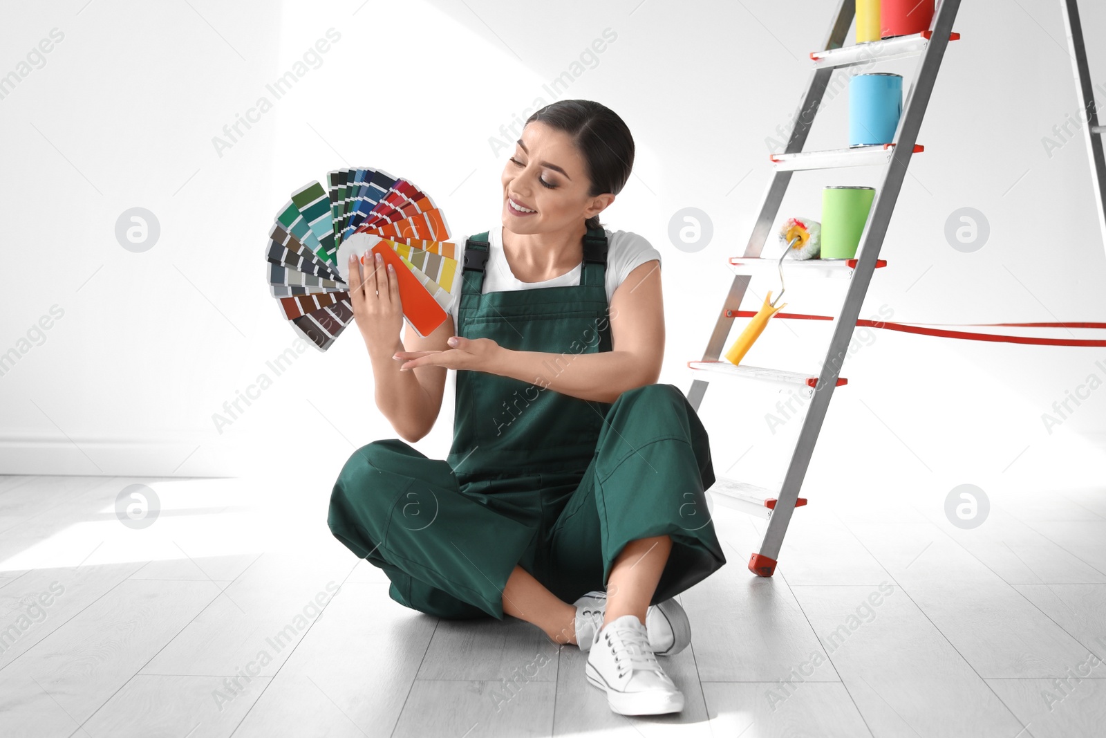 Photo of Female decorator with color palette indoors