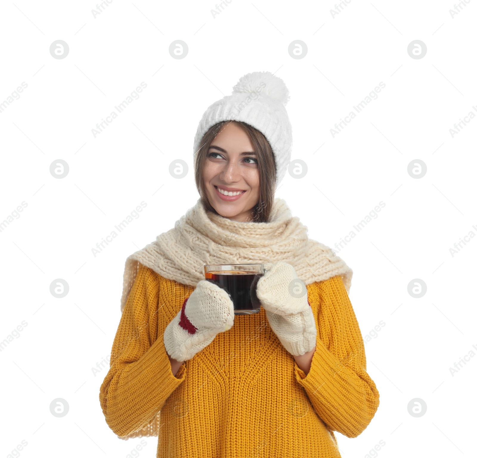 Photo of Happy beautiful woman with cup of mulled wine on white background