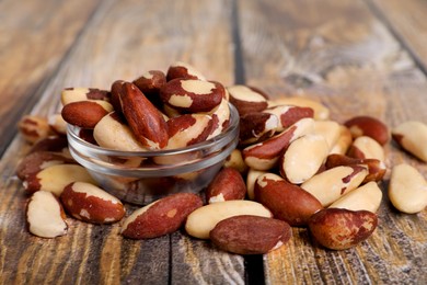 Many delicious Brazil nuts on wooden table