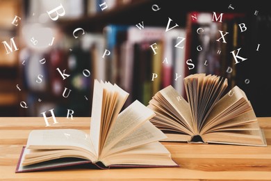 Image of Open books with letters flying out of it in library