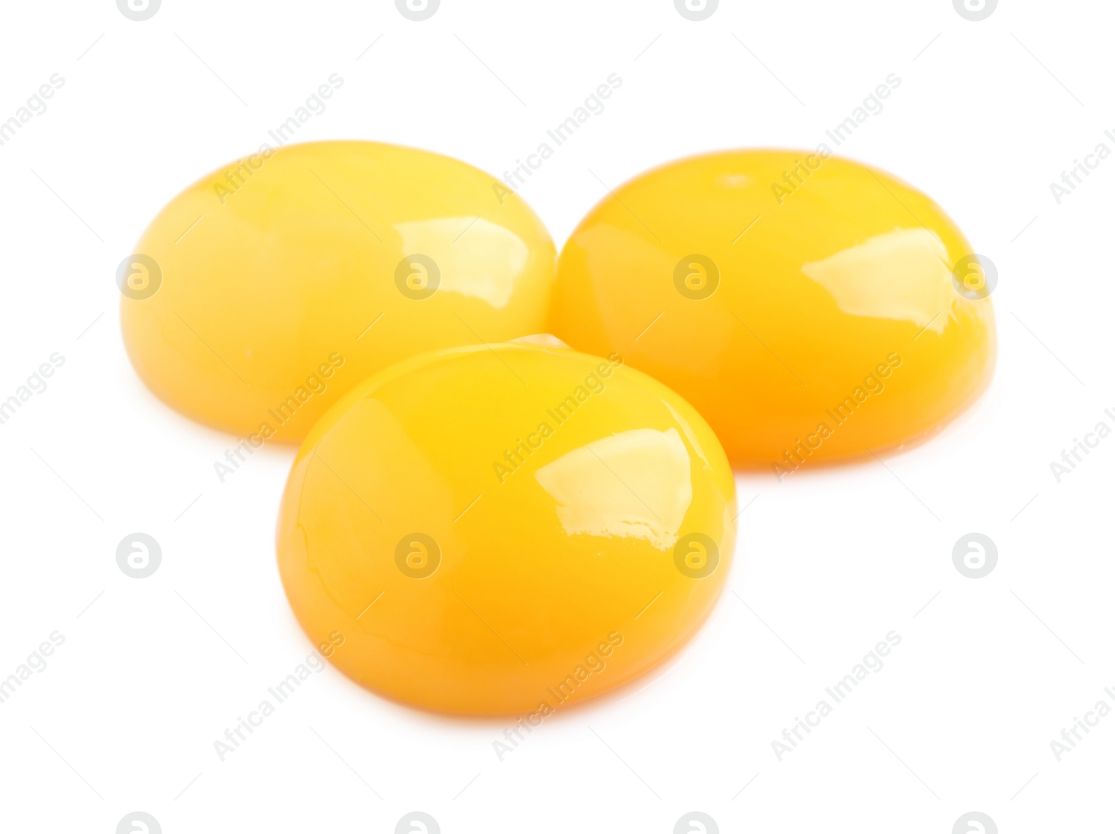 Photo of Raw chicken egg yolks on white background