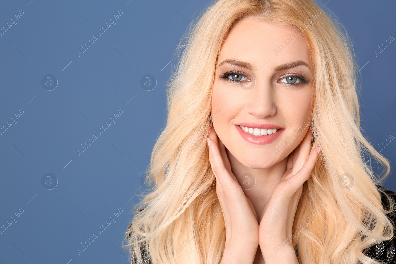 Photo of Portrait of young model with beautiful  hair on color background